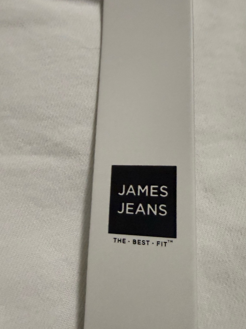 Claire's Pure White Clothing Tag with Black Text